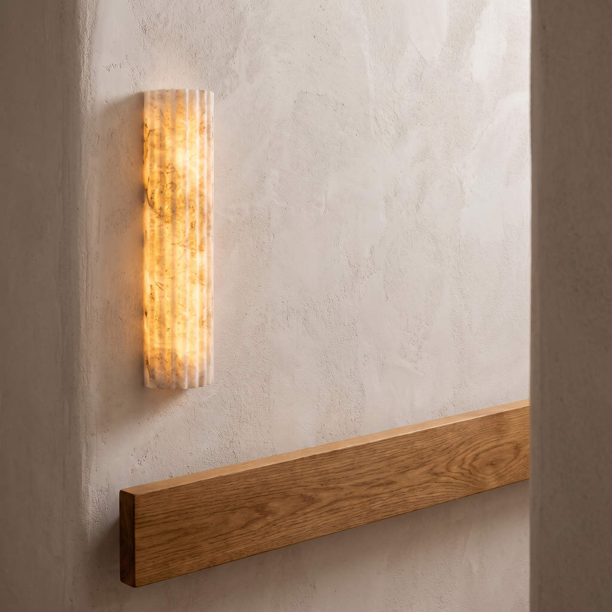 Atelierée Lumera designer alabaster LED wall light, warm white glow