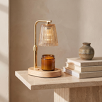 Atelierée Solene candle warmer lamp on a travertine console table