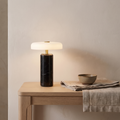 Atelierée Nero black marble rechargeable table lamp on an oak console table