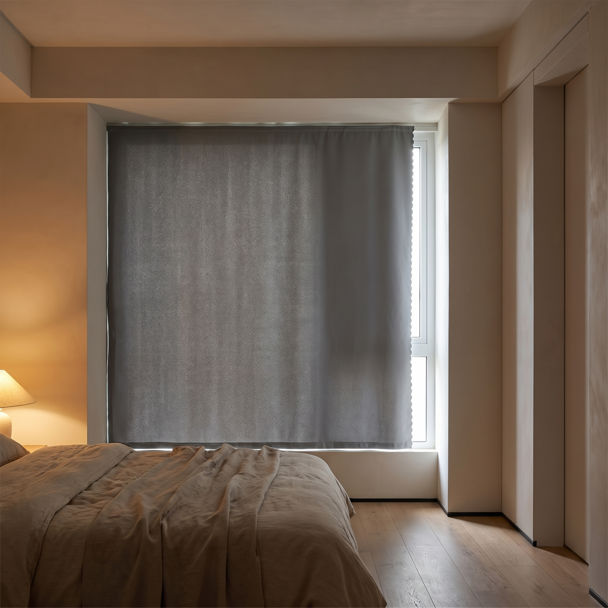 Self adhesive blackout curtain fitted across a bedroom window