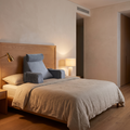 Orthopaedic bedrest reading pillow propped against a bed headboard