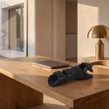 Adjustable compression hand support brace on an oak desk