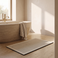 Quick dry non slip bath mat beside a freestanding bath