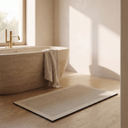 Quick dry non slip bath mat beside a freestanding bath
