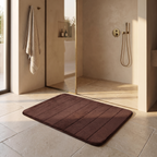 Ultra soft anti slip bath mat beside a walk in shower