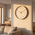 Nordic minimalist wood frame wall clock on a plaster wall