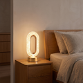 3D crystal LED night light glowing on a bedside table