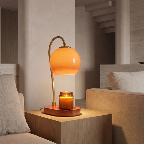 Adjustable candle warmer lamp over a candle on a side table