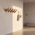 Solid oak wall rack with hooks in an entrance hall