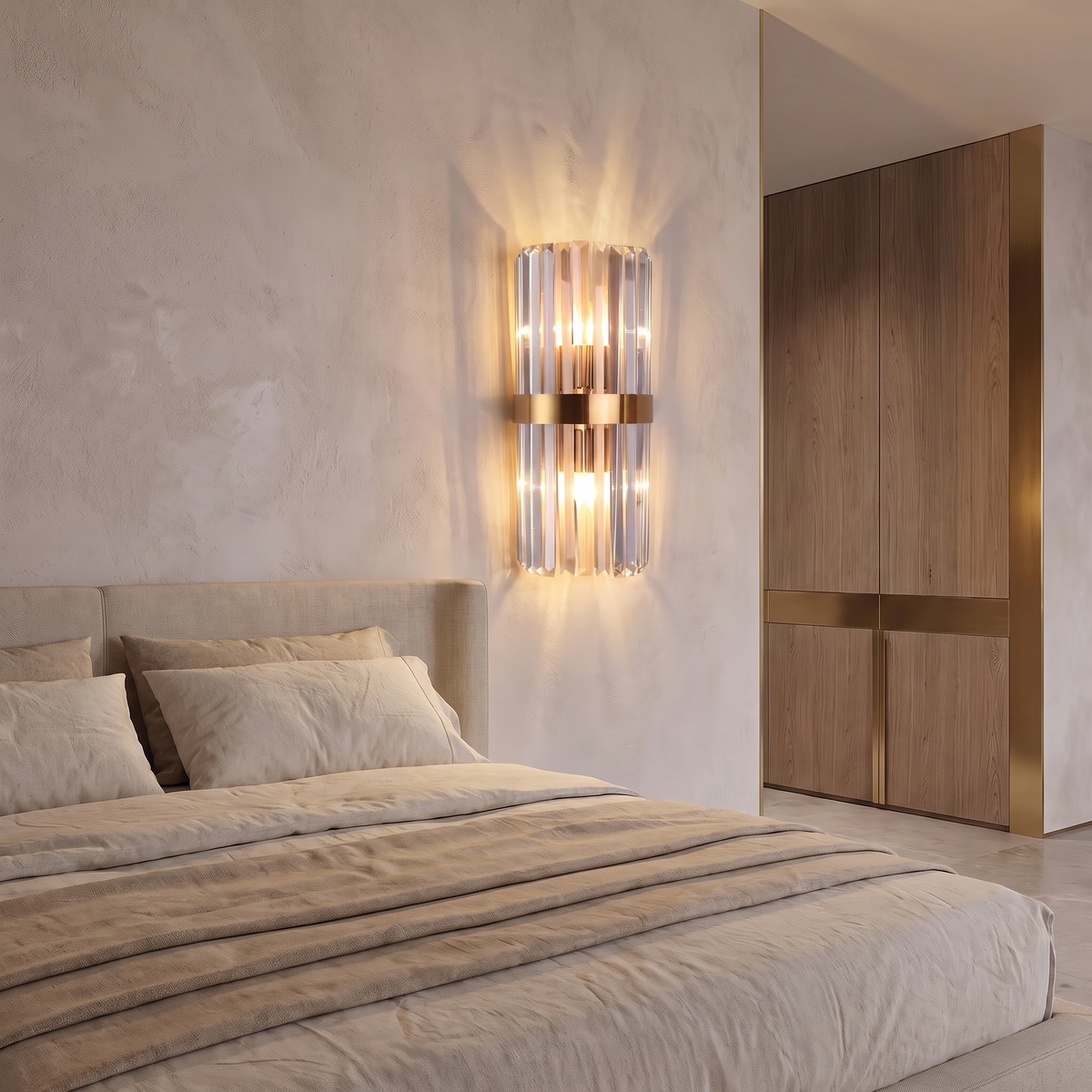 Stainless steel crystal wall sconce mounted on a plaster wall beside the head of a bed