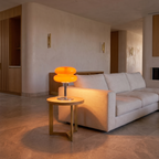 Retro Italian glass table lamp on a small side table beside a pale linen sofa
