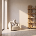 Weighted plush stuffed animal sitting in a small boucle armchair in a child's room