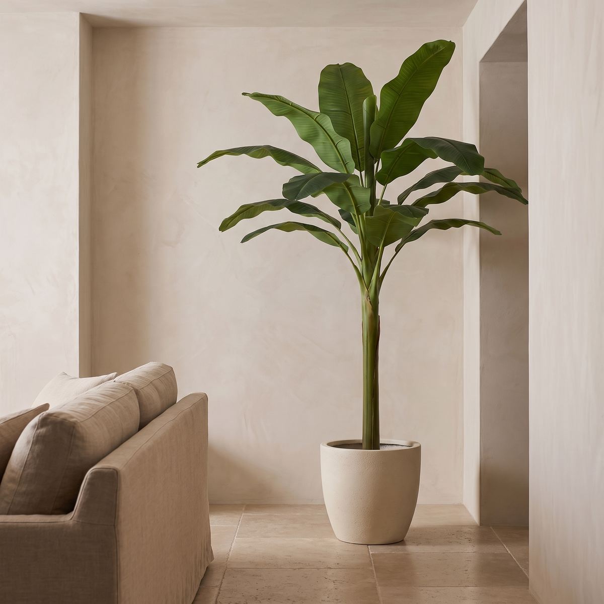 Artificial banana tree in a bright living room with a travertine floor