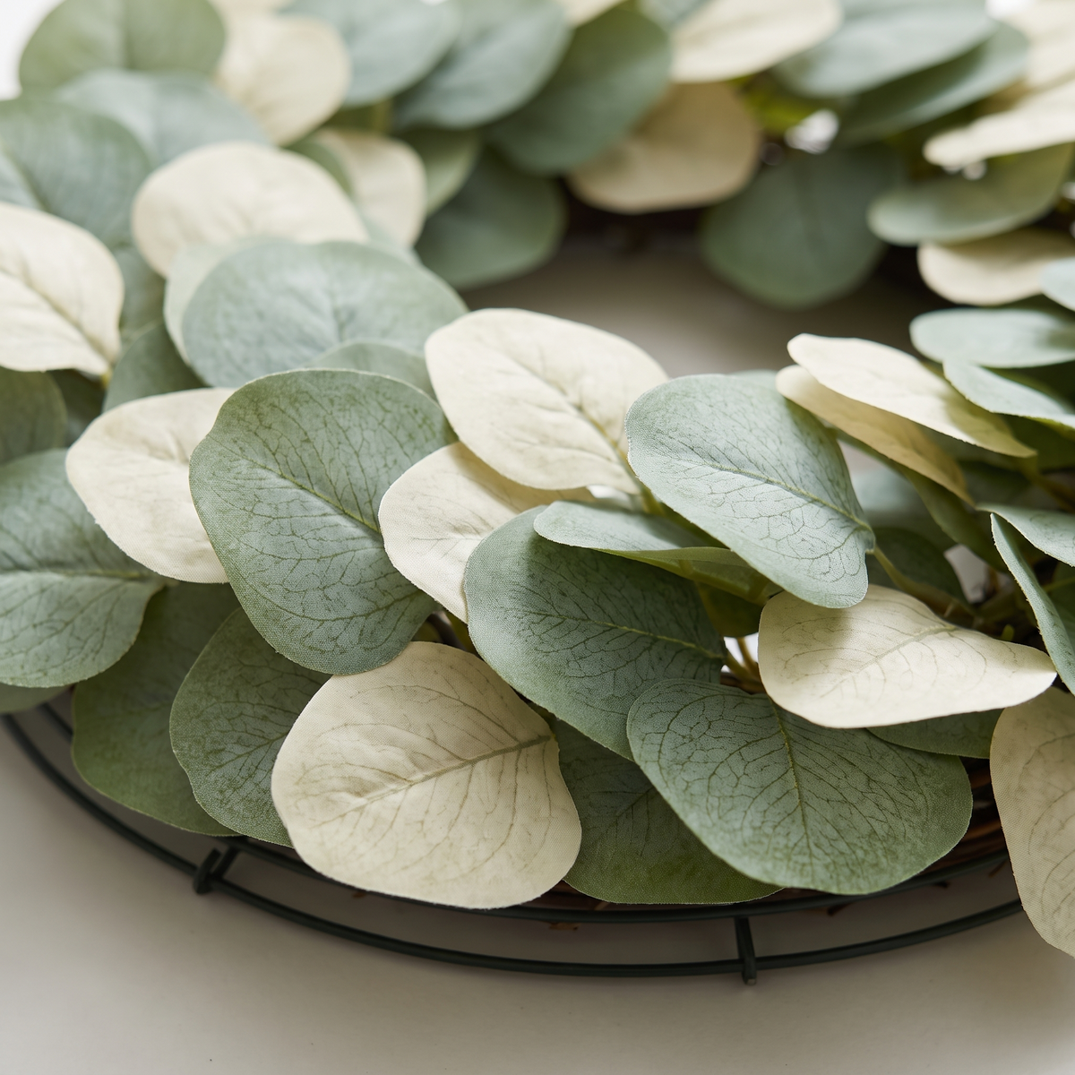 Close detail of a section of artificial eucalyptus wreath
