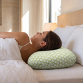 Atelierée piercing cushion pillow in use with the ear inside the cutout