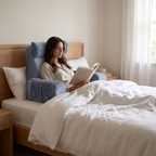 Atelierée orthopaedic bedrest reading pillow in use, sitting up in bed