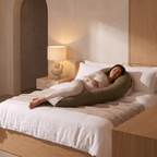 Atelierée adjustable pregnancy pillow in use, supporting a side sleeper