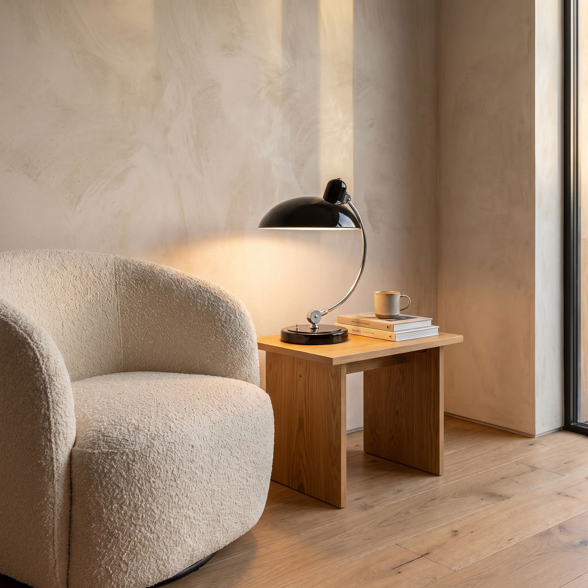 ScandiArc table lamp lit on a living room side table