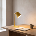 Nordic metal LED desk lamp lit on a home office desk