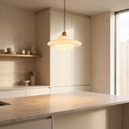 White glass pendant light above a kitchen island