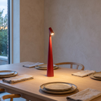 Glowora rechargeable table lamp on a laid dining table