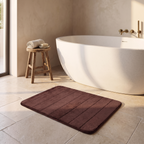 UltraSoft absorbent bath mat beside a freestanding bath