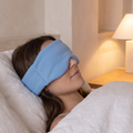 Close detail of the weighted sleep mask resting over the eyes
