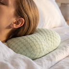 Close detail of the ear positioned over the donut pillow central hole