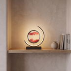 Sandlight quicksand LED table lamp on a living room shelf