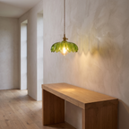 Vintage flower pendant lamp lit in a hallway