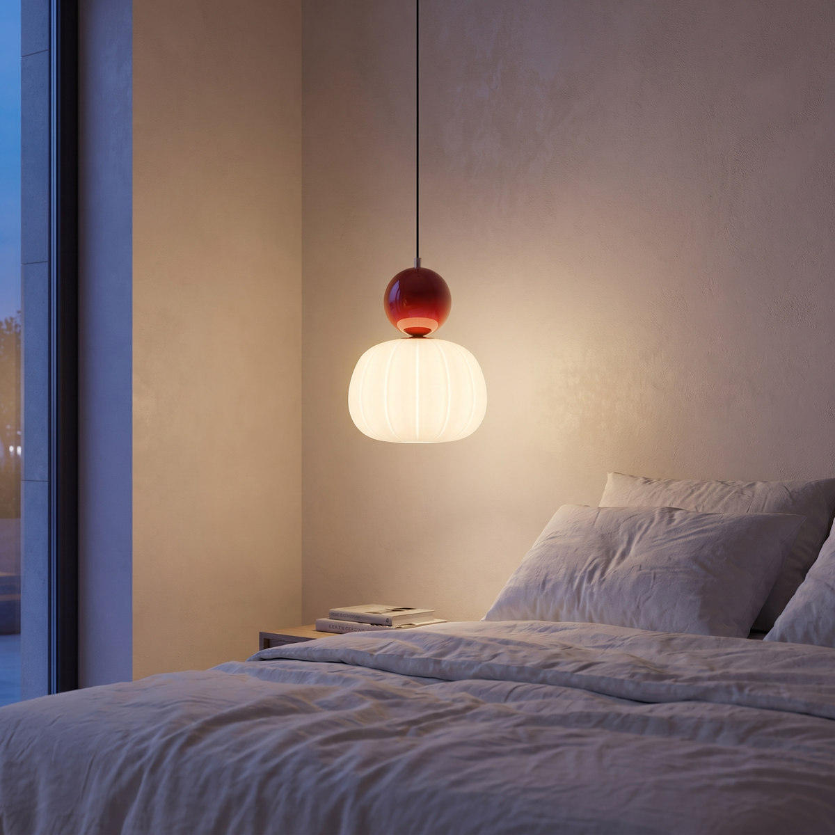 Nordic pumpkin pendant light hanging beside a bed