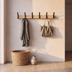 Nordic wall mounted coat rack in use with a coat and bag hanging