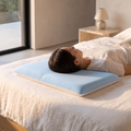Atelierée hyper slim pillow in use under the head of a front sleeper