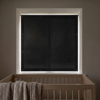 Magnetic blackout window shade fitted to a nursery window