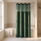 No hook shower curtain hung across a bath