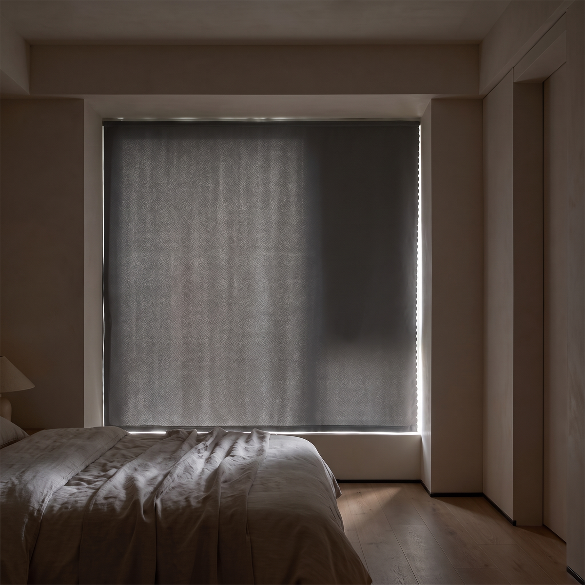 Self adhesive blackout blind fitted over a bedroom window
