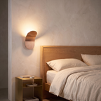 Modern Nordic wall lamp mounted beside a bed