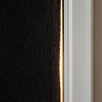 Close detail of the blackout shade magnetic edge against the window frame