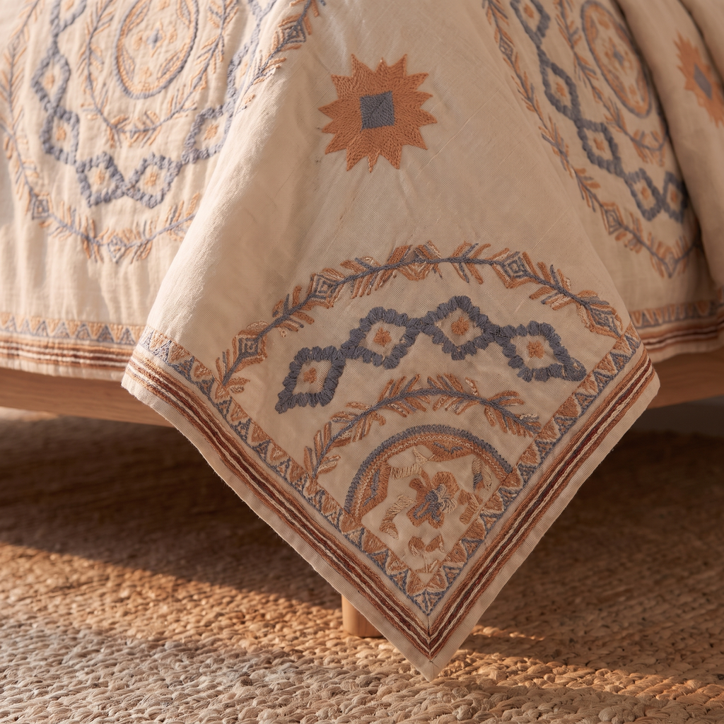 Close detail of the cotton gauze weave and hem of the bedspread