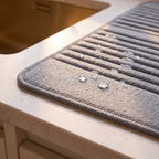 Close detail of the draining mat absorbent surface and bound edge