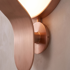 Close detail of the Nordic wall lamp diffuser arm and wall mount