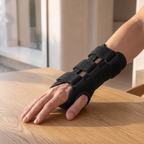 Atelierée compression wrist splint being worn at a desk