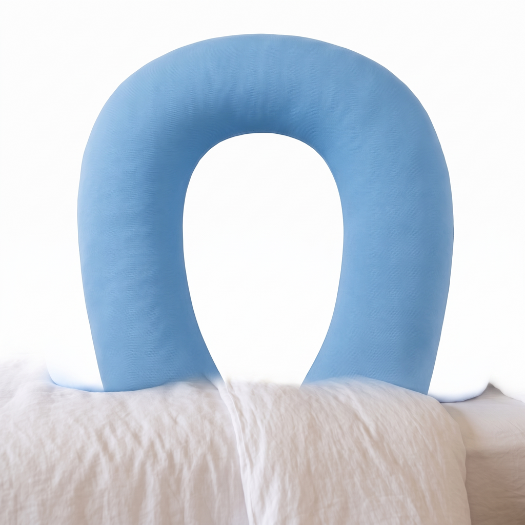 Side sleeper pillow with arm hole on a plain white background