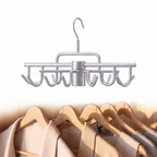 Rotating multi hook clothes hangers on a plain white background