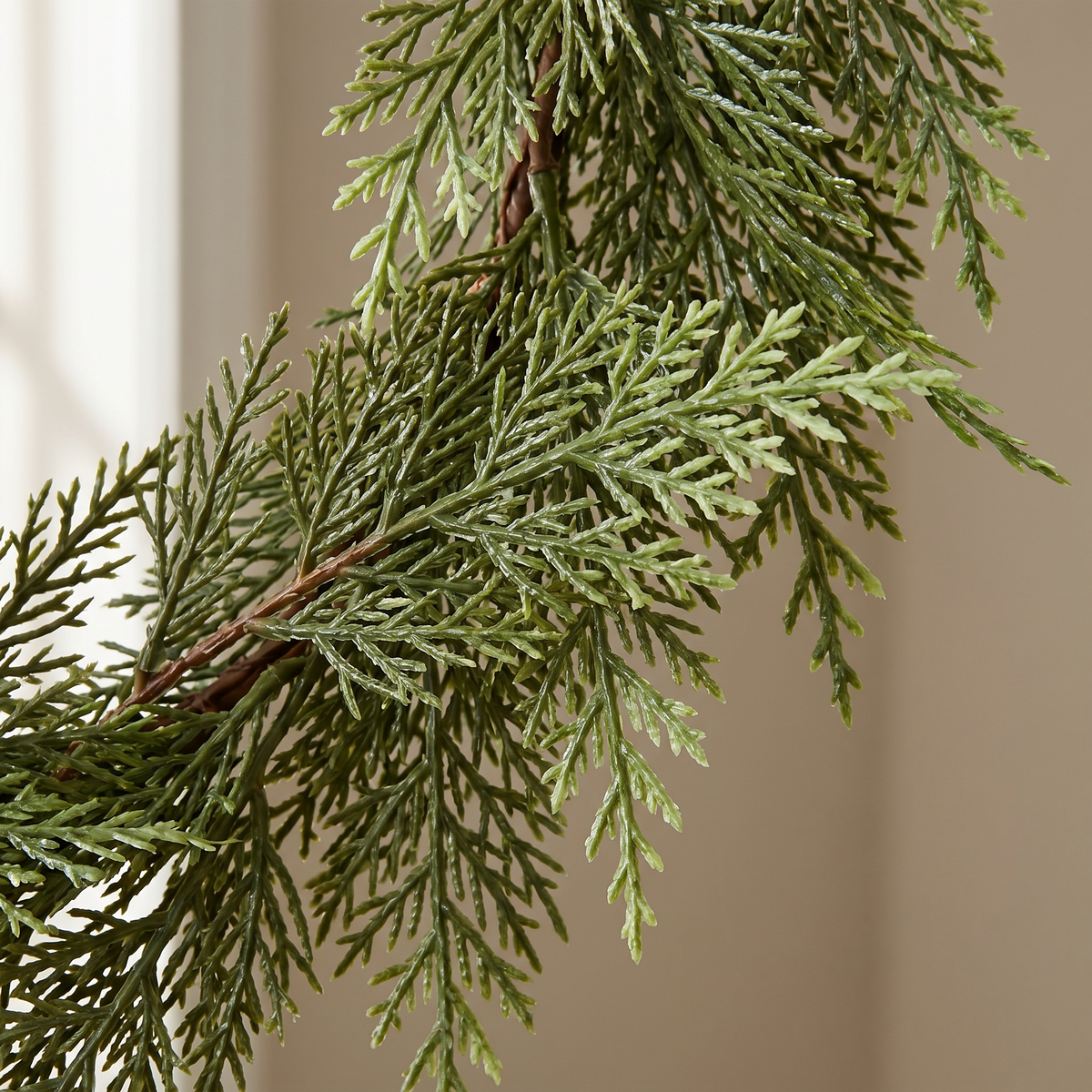 Close up of the real touch cedar foliage and wired stem on the Thornwood garland