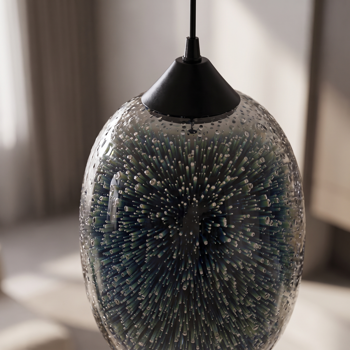 Close up of the textured glass and internal structure of the Stellaria pendant light