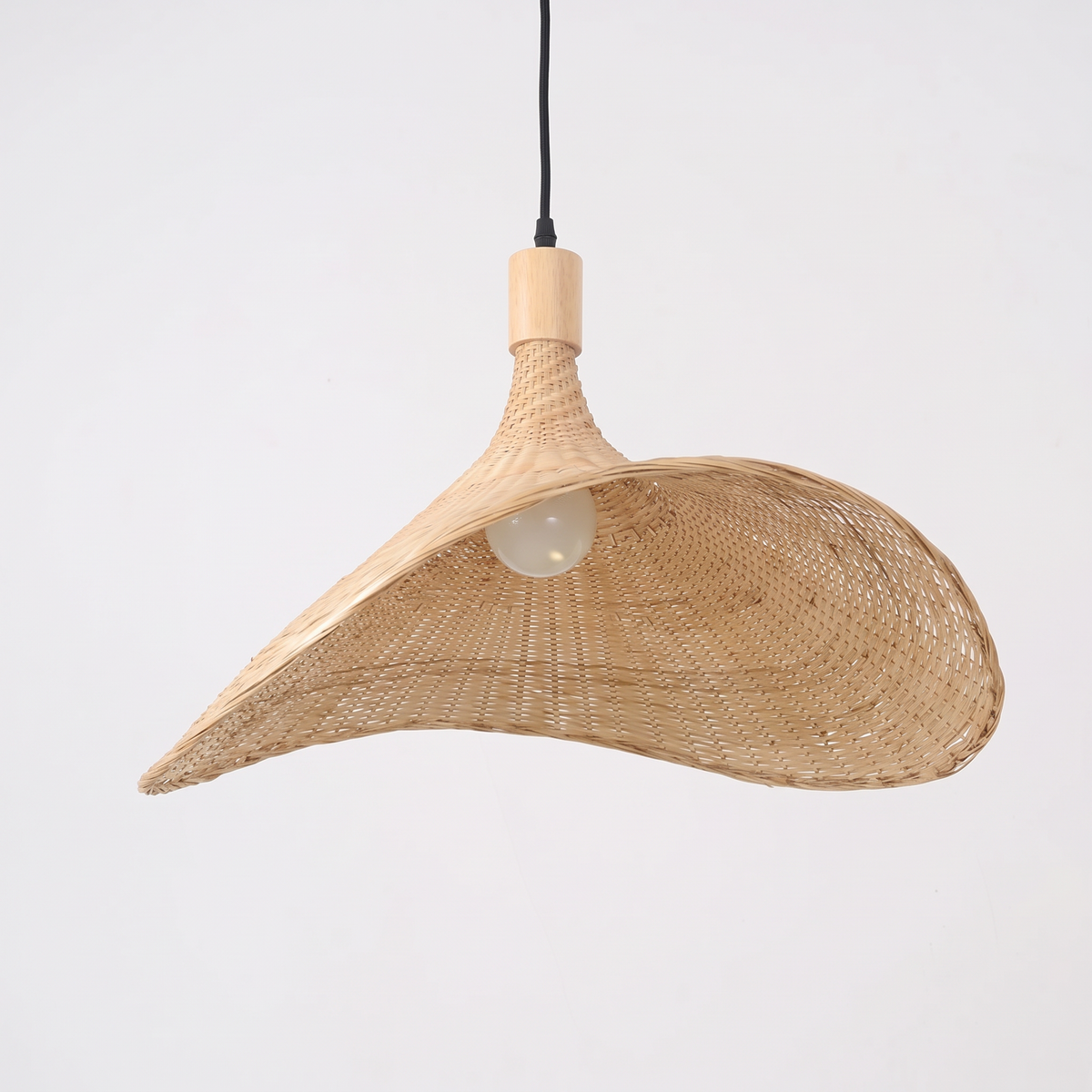Atelieree Vimini hand woven rattan pendant light on a white background