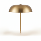 Gold iron cordless mushroom table lamp switched off on a white background