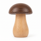 Walnut and beech wooden mushroom night light switched off on a white background