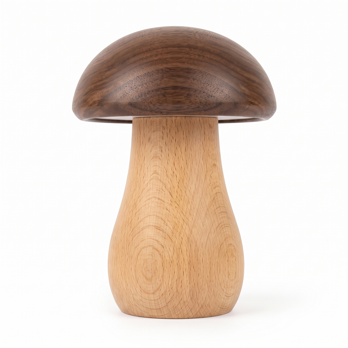 Walnut and beech wooden mushroom night light switched off on a white background